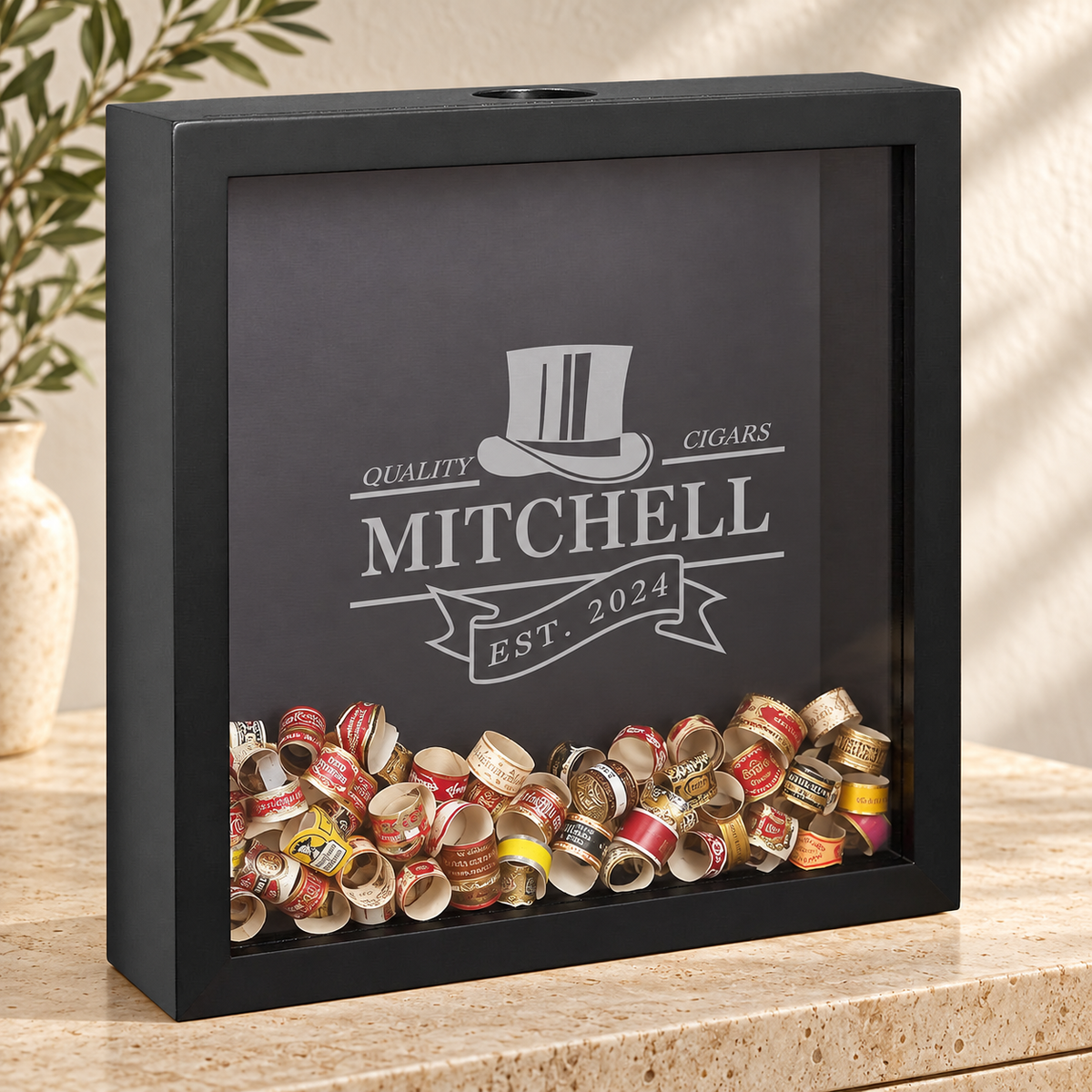 Personalized Cigar Band Display in a warm interior; example personalization
